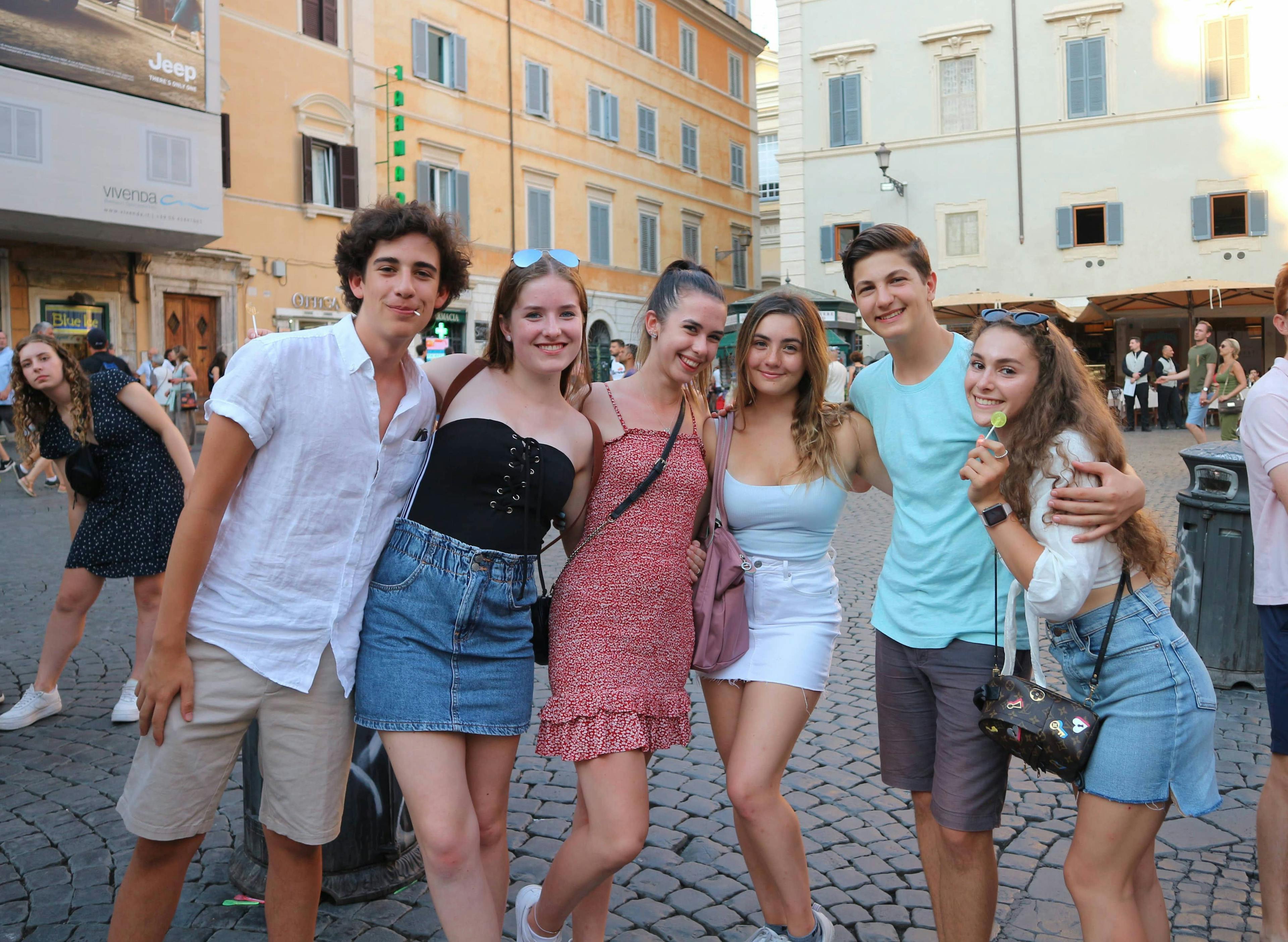 High school students posing for a photo in a piazza in Rome, Italy